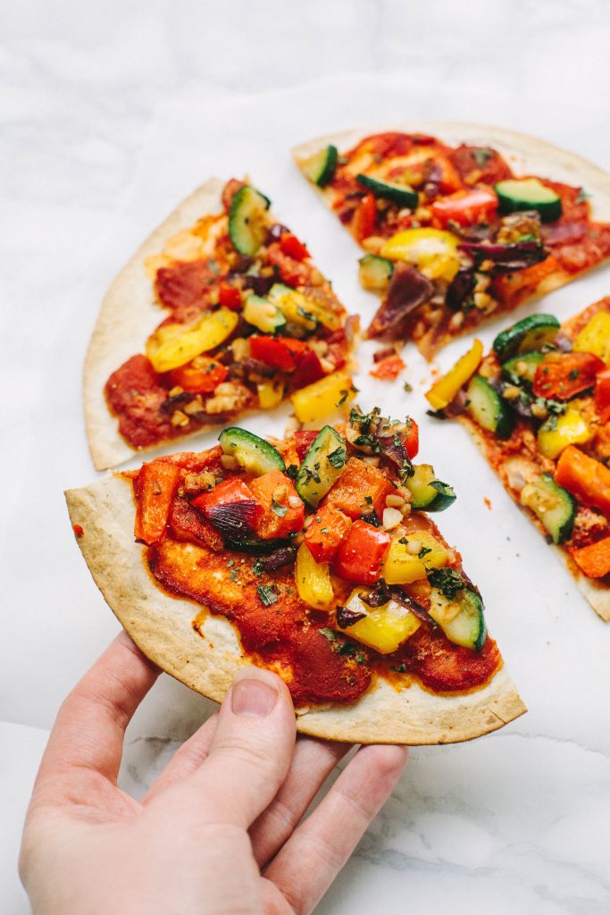 Vegan Tortilla Pizza with spicy arrabiata sauce and Mediterranean vegetables - only 180 kcal per pizza! Gluten-free option.