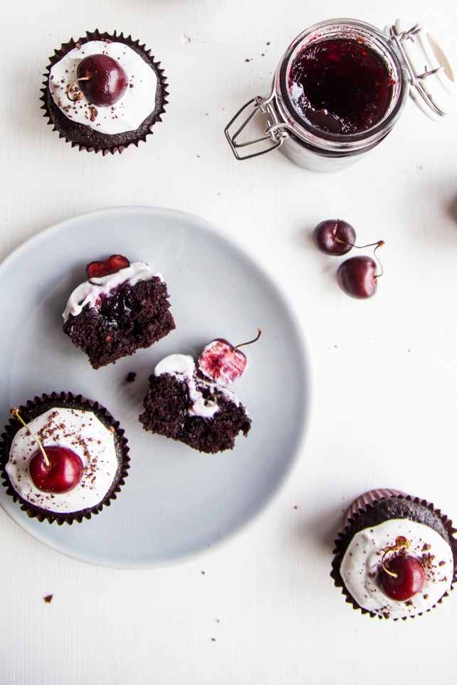 Black Forest Cupcakes! Rich chocolate cupcakes filled with cherry jam and topped with coconut cream (vegan + no refined sugars)