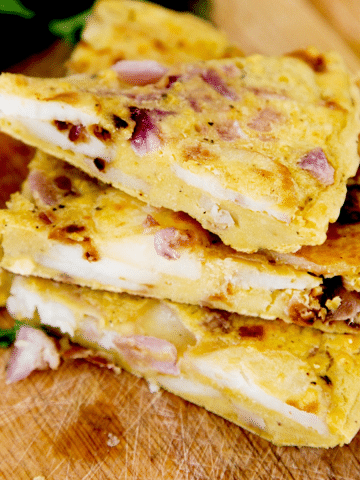 A vegan Spanish Omelette made with sliced potato and chickpea flour. Easy, healthy, frugal and so delicious!